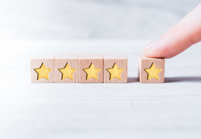 4 blocks with stars on them and a finger pushing the 5th star block into screen